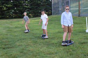 Boys on Onewhell boards at the end of school party held at Ashlawn estate, hosted by Joe Lara and Gwen Shamblin Lara.