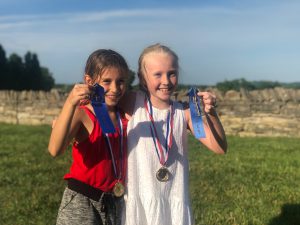 Best buds and blue ribbon winners, Liana Lara and Gloria Hannah took first place in their respective races. End of school party held at Ashlawn estate, hosted by Joe Lara and Gwen Shamblin Lara.